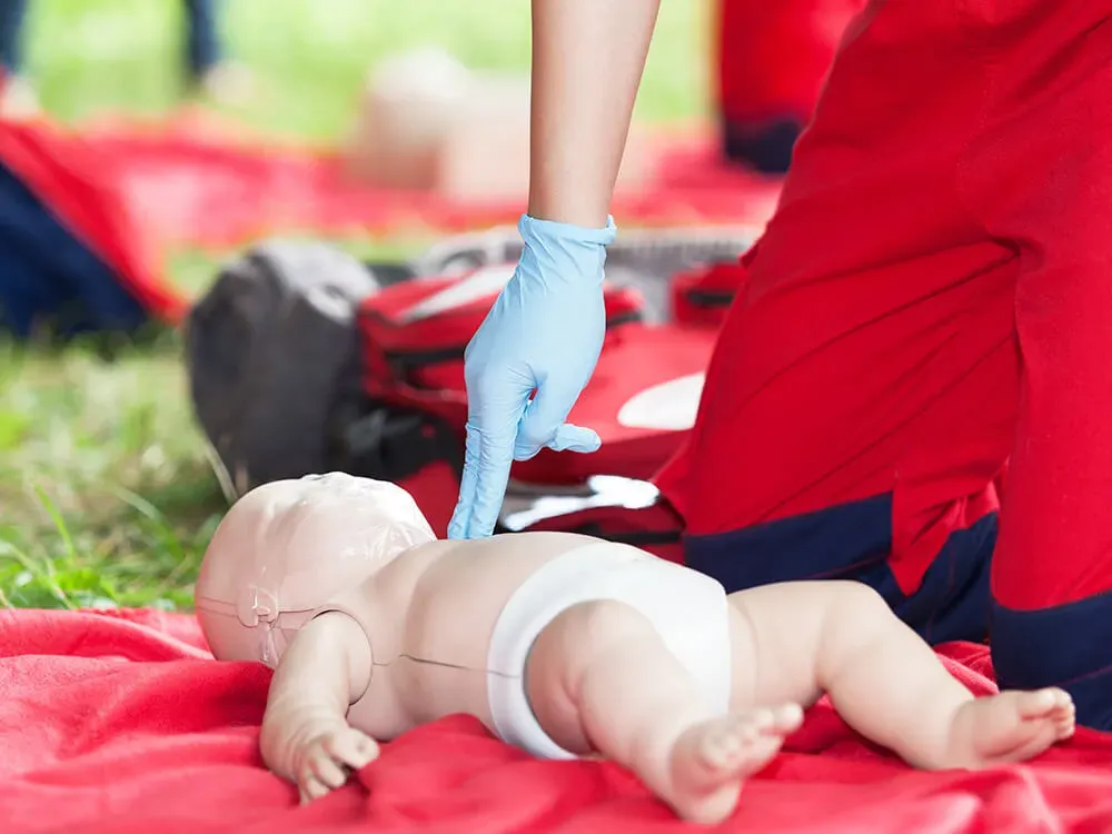 CPR technique being performed on a child