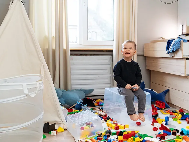 Child demonstrating problem-solving skills while preparing for school