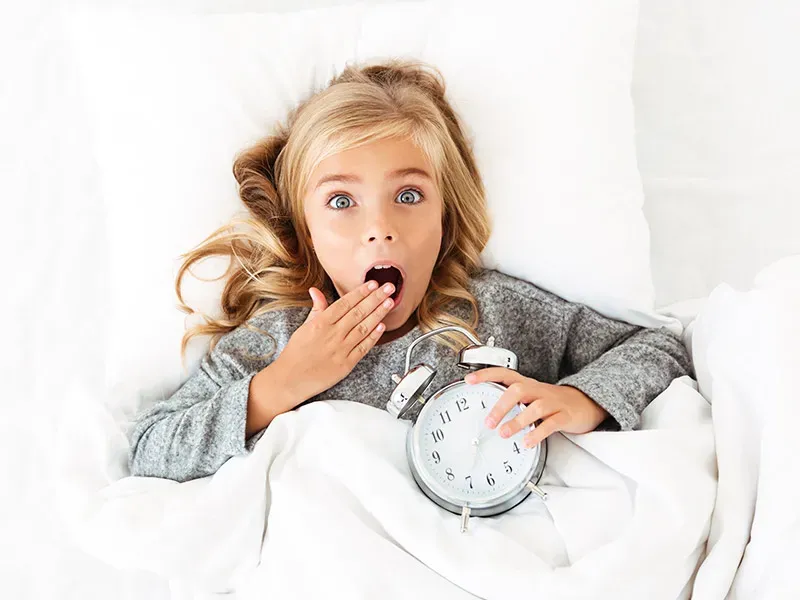 Child following a visual morning routine chart step by step