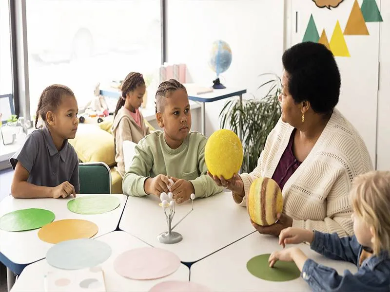 Daycare centre with qualified staff supervising children in group activities