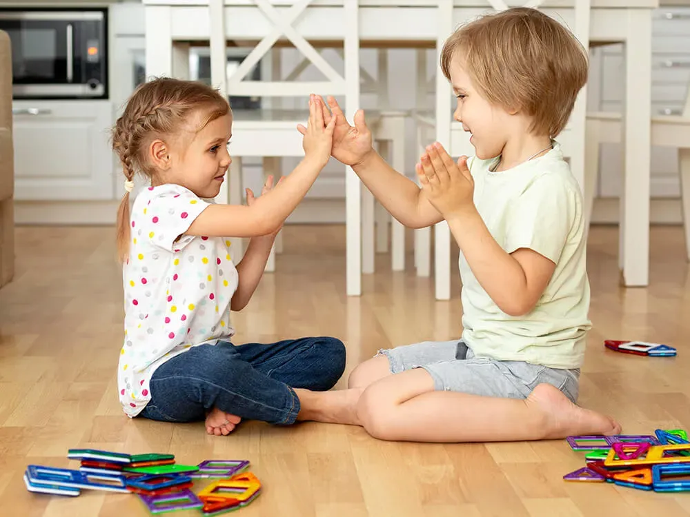 Happy child showing improved social skills while playing with friends