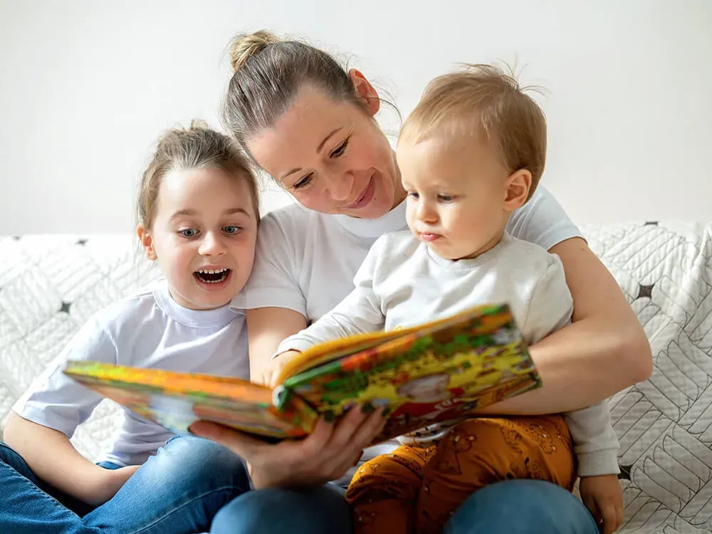 Toddler engaging with a colorful picture book during interactive reading time