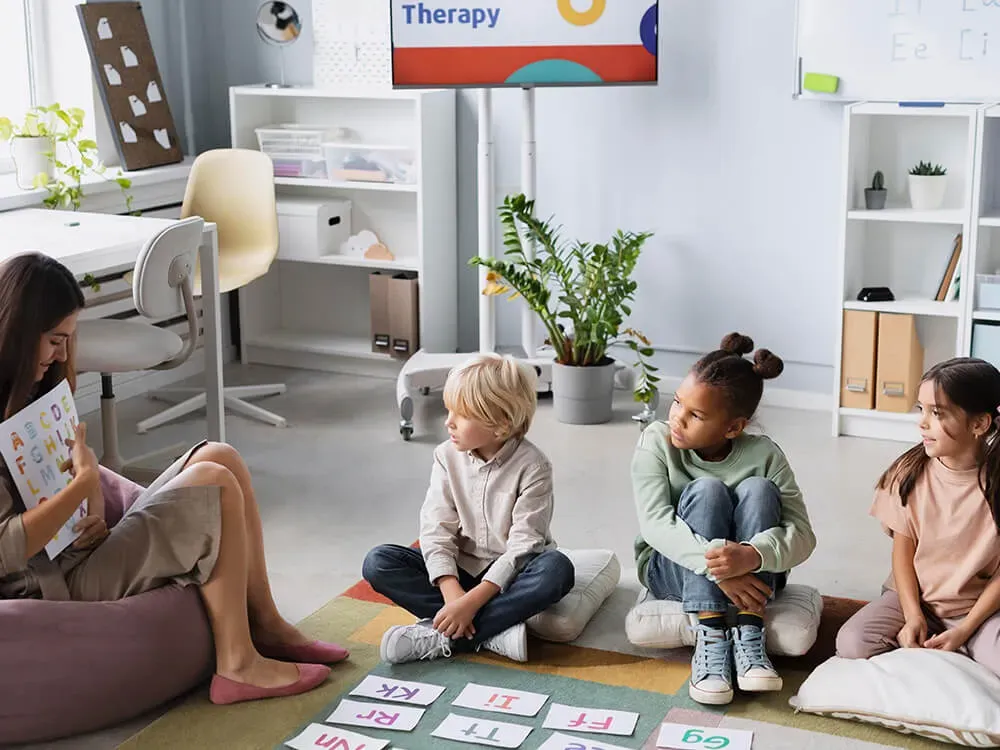 Daycare staff reviewing workers compensation and additional insurance policy documents