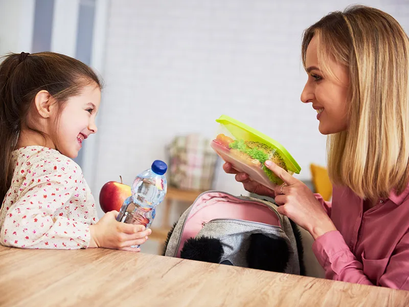 Child preparing a simple breakfast as part of building morning independence